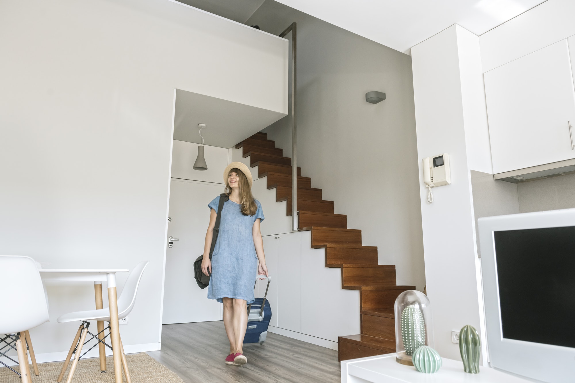 Tourist entering modern vacation home